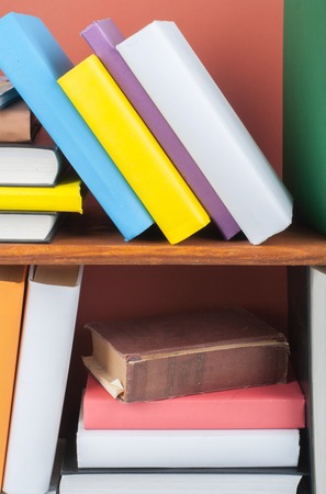 Open book, hardback colorful books on wooden table. Back to school. Copy space for text. Education business concept.の写真素材