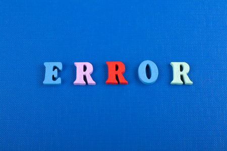 ERROR word on blue background composed from colorful abc alphabet block wooden letters, copy space...