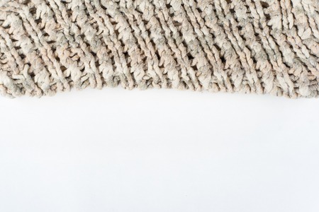 Sweater or scarf fabric texture large knitting. Knitted jersey background with a relief pattern....