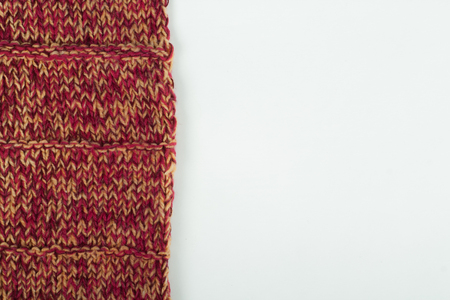 Sweater or scarf fabric texture large knitting. Knitted jersey background with a relief pattern. Wool hand- machine, handmade, red,の写真素材