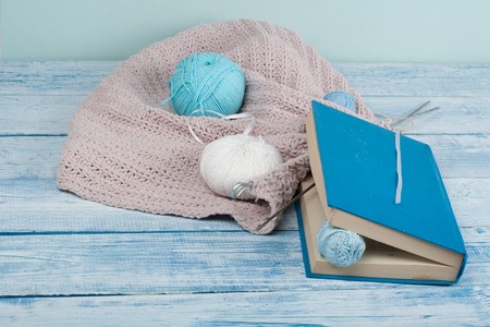 Handmade gift for special day as mother day, father day, valentine day or wintertime, heap of ball of wool to knit colorful scarf for cold day, knitting to make special meaningful vintage blue present.の写真素材