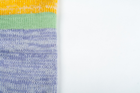 Sweater or scarf fabric texture large knitting. Knitted jersey background with a relief pattern. Wool hand- machine, handmade.の写真素材