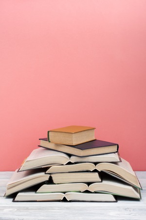 Open book, hardback colorful books on wooden table. Back to school. Copy space for text. Education business conceptの写真素材