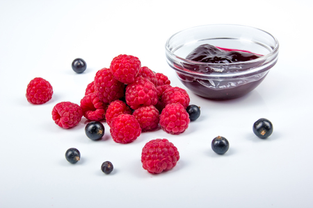 Homemade jam. Glass bowl with jam on a white background. Preserved berry. Top view