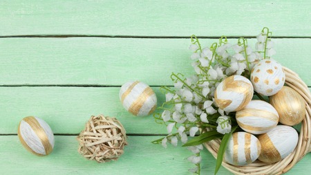 Happy Easter. eggs isolated on wooden table background.. Balls, wreath woven from the vines. Copy...