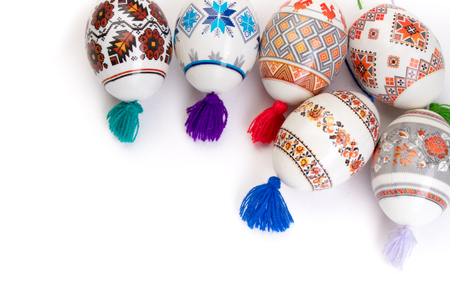 Happy Easter card. Colorful shiny easter eggs on isolated white background. Copy space for text.の写真素材