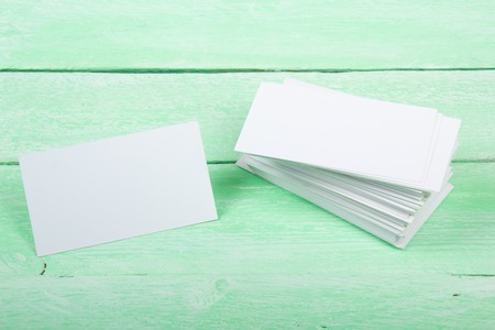 Blank business cards on the wooden table. Template for ID. Top view.の写真素材