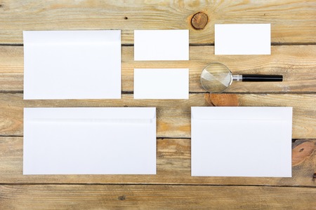 Business card. Corporate stationery set mockup. Blank textured brand ID elements on wooden table....