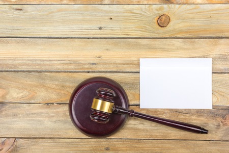 Law concept. Business card. Corporate stationery set mockup. Blank textured brand ID elements on wooden table, gavel. Top view.の写真素材