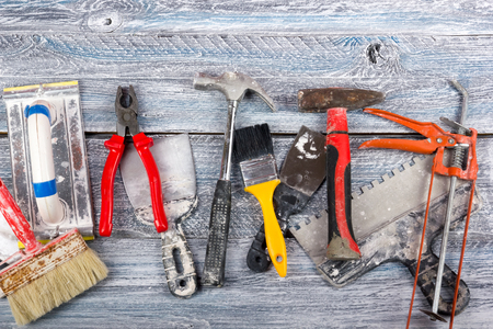 professional repairing implements for decorating and building renovation set on the wooden background. Electrical tools. Top view. Copy space for text.の写真素材