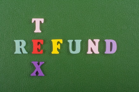 TEX REFUND word on green background composed from colorful abc alphabet block wooden letters, copy space for ad text. Learning english concept.の写真素材