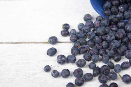 Blueberry on wooden table background, bowl of blueberries. .Antioxidants, detox diet, organic fruits. Berriesの写真素材