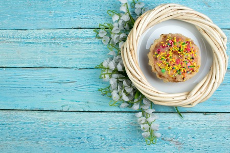 Happy Easter. Painted eggs on wooden table. Easter Cake - Russian and Ukrainian Traditional Kulich, Paska Easter Bread. Top view. Copy space for text.の写真素材