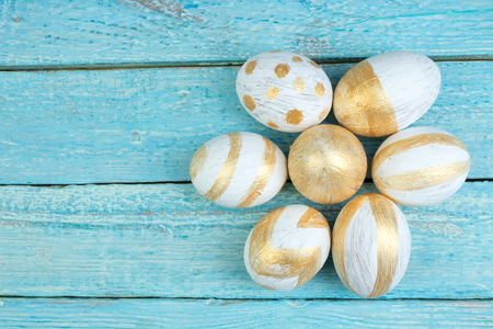 Happy Easter. Painted eggs on wooden table. Top view. Copy space for text.の写真素材