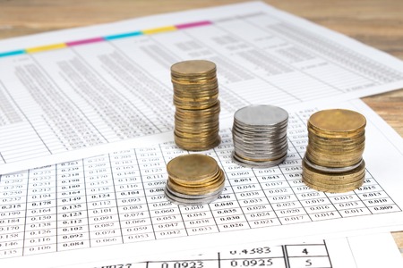 Financial Charts, graphs, one, calculator on a wooden table.の写真素材
