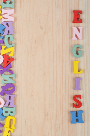 English word on wooden background composed from colorful abc alphabet block wooden letters, copy space for ad text. Learning english concept.の写真素材
