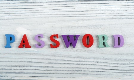 PASSWORD word on wooden background composed from colorful abc alphabet block wooden letters, copy space for ad text. Learning english concept.の写真素材