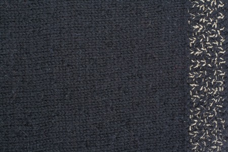 Sweater or scarf fabric texture large knitting. Knitted jersey background with a relief pattern....