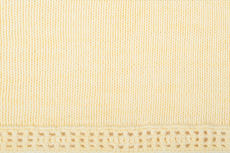 Sweater or scarf fabric texture large knitting. Knitted jersey background with a relief pattern. Wool hand- machine, handmade. Crochetingの写真素材