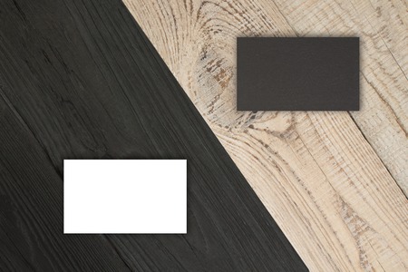 Blank business cards on the wooden table. Template for ID. Top view.の写真素材