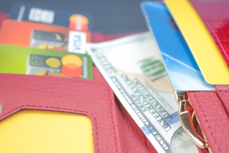 open wallet with bank cards and dollar bills.の写真素材