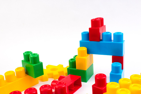 Lot of colorful rainbow toy bricks background. Educational toy for children Isolated on white background. 3D Rendering. Top view with copy space.の写真素材