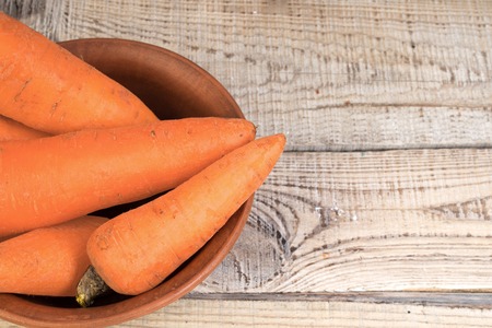 Organic vegan food. carrots on wooden background. country style.の写真素材