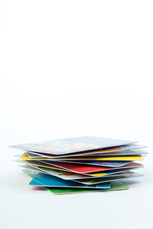 Stack of bank cards on a white background.