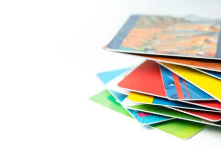 Stack of bank cards on a white background.の写真素材