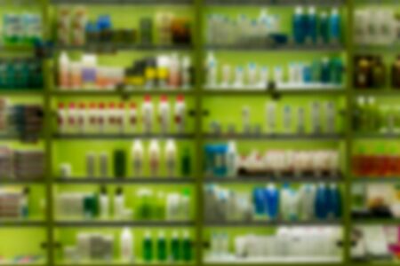 Blur image rows of hair care products on display at store. Cosmetic Products For Sale In Beauty...