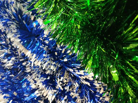 Colorful tinsel , Christmas decorations holiday backgroundの写真素材