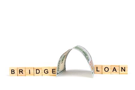 Bridge loans- word composed fromwooden blocks letters on White background, copy space for ad text.の写真素材