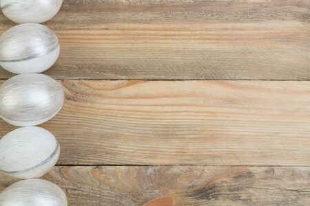 Happy Easter. Painted eggs on wooden table. Top view.の写真素材