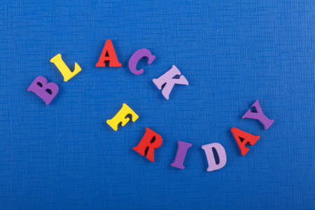 BLACK FRIDAY word on blue background composed from colorful abc alphabet block wooden letters, copy space for ad text. Learning english concept.の写真素材