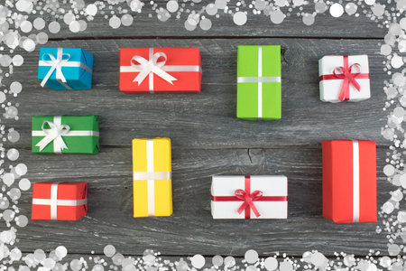 Gift boxes and colorful present for christmas on wood table. Top view with copy space.の写真素材