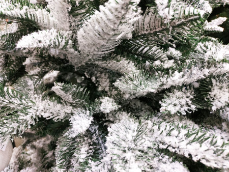 Artificial, diverse Christmas pine tree, snow, background.の写真素材
