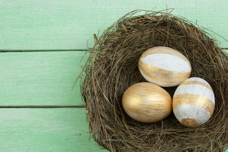 Happy Easter. Top view nest with Painted eggs on wooden table. Copy space for textの写真素材