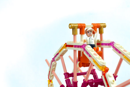 Developing childrens designer. Ferris wheel with puppet men. Isolated on white background. Lego.のeditorial素材