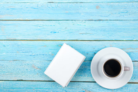 Blue office desk table with computer, pen and a cup of coffee, lot of things. top view with copy spaceの写真素材