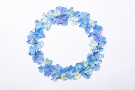 Flowers composition. Frame made of blue flowers hydrangea on white background. Creative floral texture. Flowers pattern, flat lay. Spring holidays, Easter, Mothers day concept. Top view, copy space
の写真素材