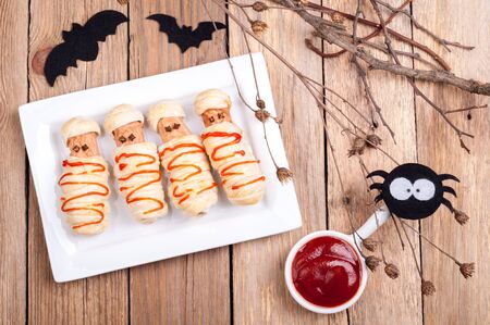 Funny sausage mummies with ketchup for Halloween. Top viewの写真素材