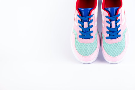 Fashionable sport shoes on white background. Sport, healthy lifestyle, fitness, exercise, workout concept. Female sport equipment. Copy spaceの写真素材