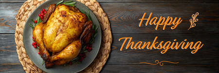 Baked chicken for festive dinner. Cooked chicken or turkey with herb rosemary and berries on wooden...