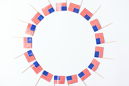 4th of July American Independence Day. Independence day frame made of USA flag on white background. Flat lay, top view, copy spaceの写真素材