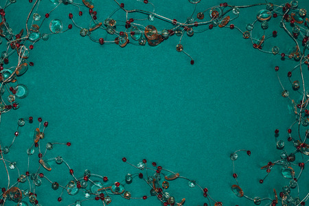 Beautiful colorful strass garland decoration on dark green background.の写真素材
