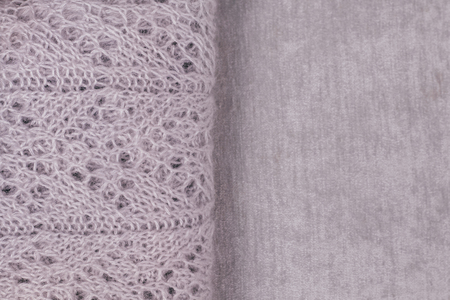 Stylish pastel colored sweater with visible pattern folded on velvety fabric. Top view, copy space.の写真素材
