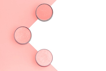 Cosmetics flat lay on coral and isolated white background. Copy space.の写真素材