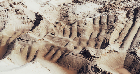 Industrial sand quarry with buldozer tracks. Sand pit. Construction industry.の写真素材