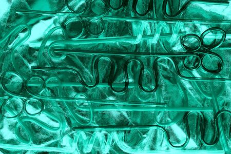 Neon plastic straws for drinks. Modern version of eco concept in trendy mint color.