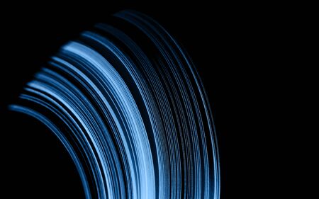 Macro photo of bright wavy paper tapes on isolated black background. Abstract modern background in...